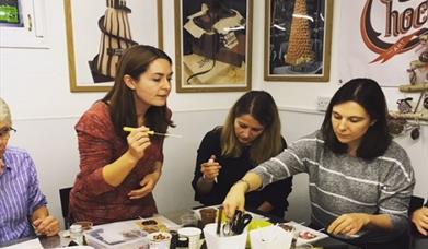 Group making chocolates at Chocolatician