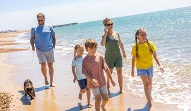 Family walking on a beach