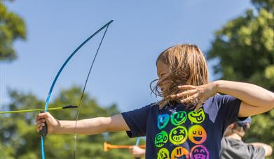 A child does archery.
