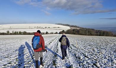 walkers on the south downs way on an frosty morning