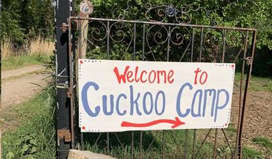 A gate with cuckoo camp on