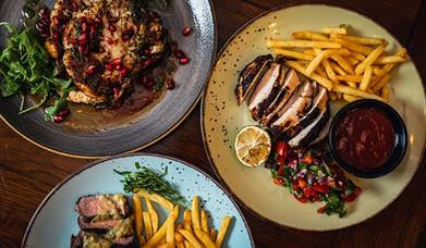 Multiple steaks on a plate