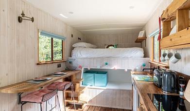 a studio room with breakfast bar, kitchenette and bunk beds