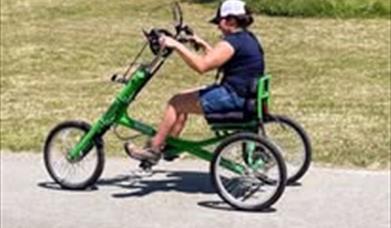 A person using a hand propelled bike