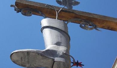 Duke of Wellington boot hanging in front of the pub in Shoreham