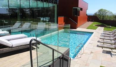 sunny day and view of the outdoor swimming pool
