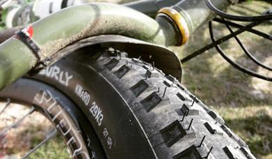 Close up of muddy bike wheel