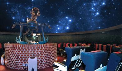 Planetarium with telescope and starry ceiling
