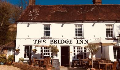Outside of the Bridge Inn with terrace in sunshine