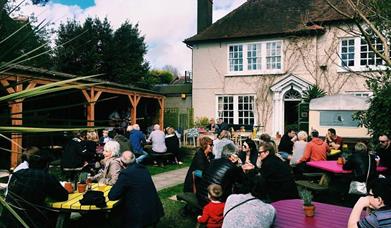 The Gun Inn outdoor seating area full of customers