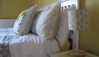 A picture of the top of a bed with pillows in a guest room at Hill View accommodation