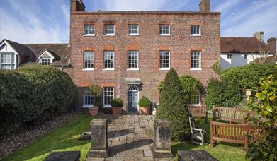 image of the outside of the house looking at the front entrance and garden