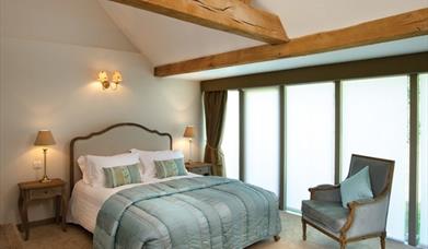 Halfway Bridge Inn guest bedroom with oak beams
