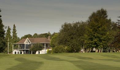 view of the club house and golf course