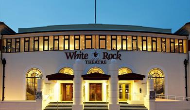 view of the theatre entrance with all the lights on