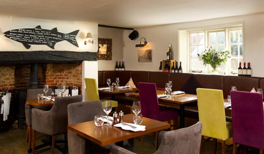 Dining tables at the Crab and Lobster|Crab and Lobster inside dining area by fireplace