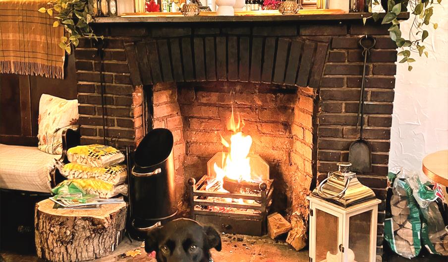 Cosy fire in the lounge area of the The Queens Head in West Chiltington