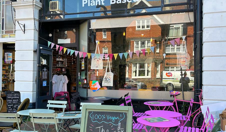 Outside the front of the restaurant showcasing the outdoor seating and the vibrant signage