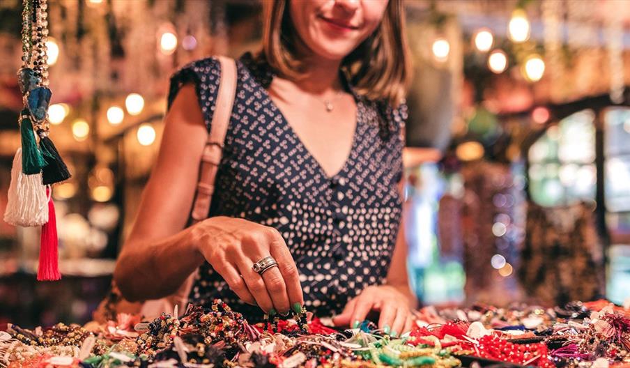 Woman browsing handmade crafts