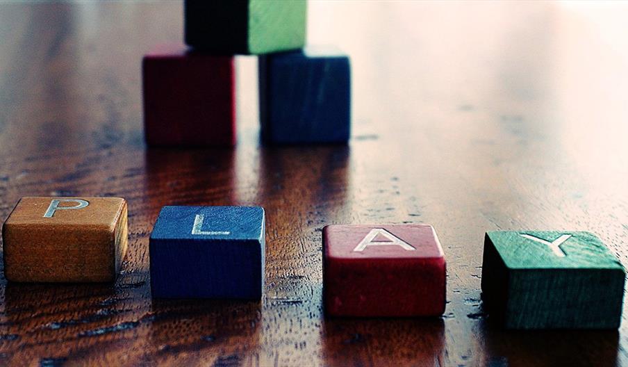 Colourful children's blocks spelling the world play