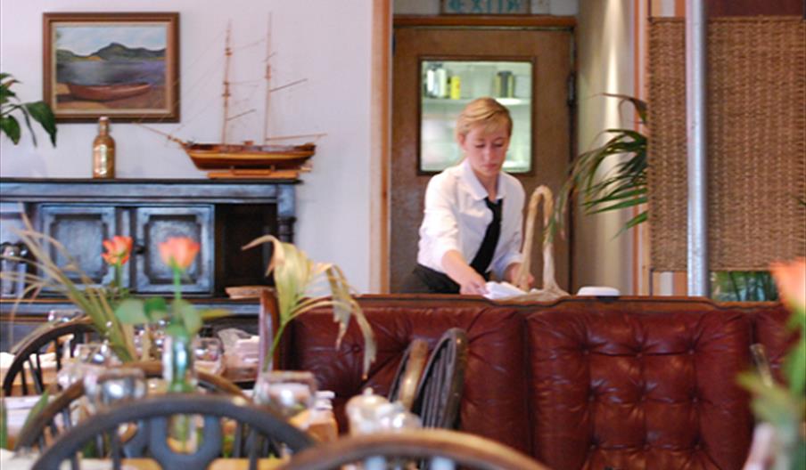 Inside view of waitress at 47 Mussel Row|Waitress working inside 47 Mussel Row restaurant