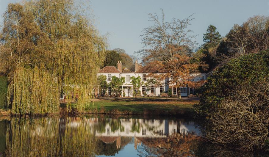 a view across the lake of the accommodation