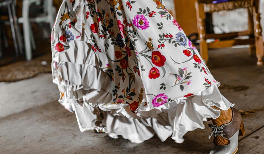 White dress with ruffles and bright flowers