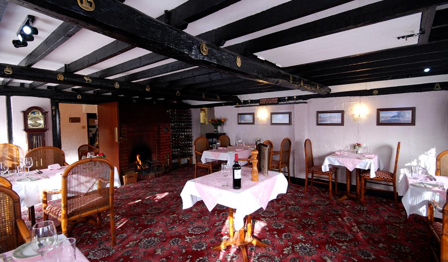 interior of dining area with low wooden beams