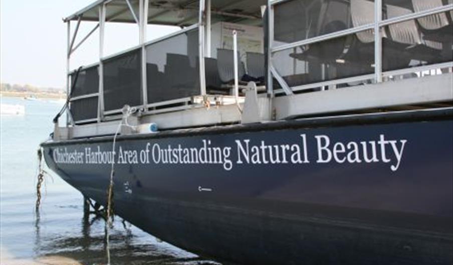picture of the side of the boat showing seating on the deck