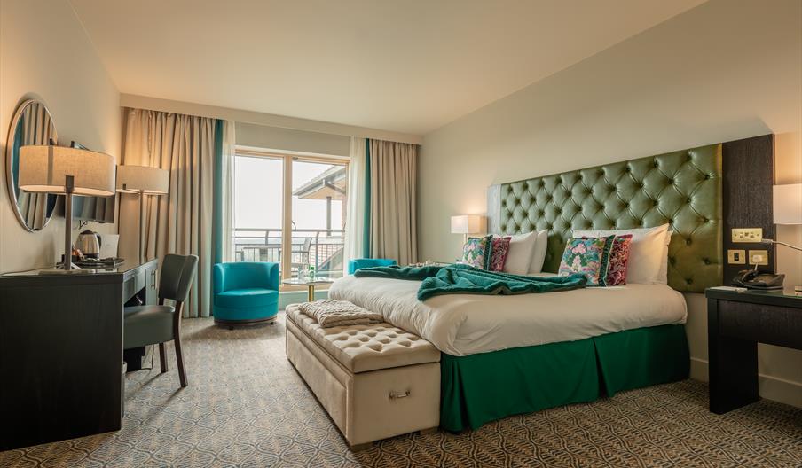 spacial double bedroom with doors to balcony