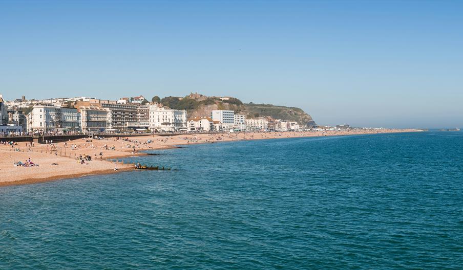seafront at Hastings showing blue see and shingle beach