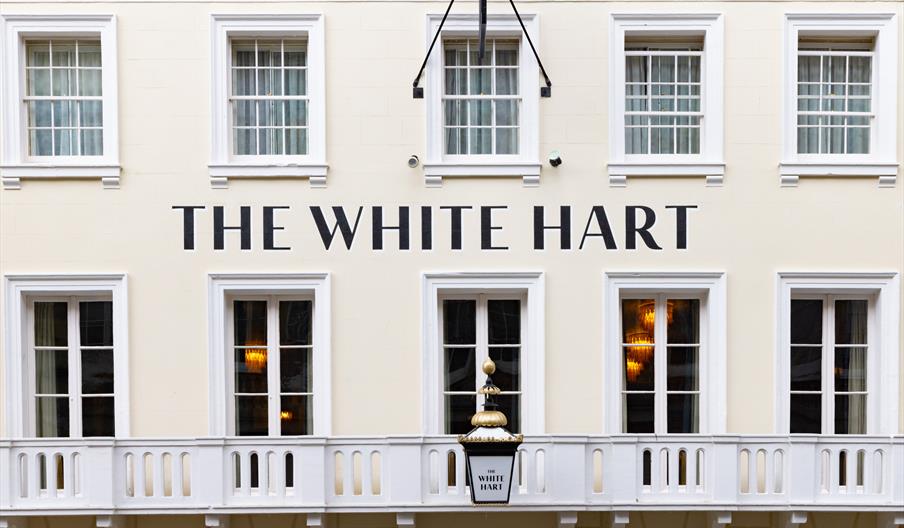 Exterior of the white hart hotel, a white painted 16th century coaching inn in Lewes