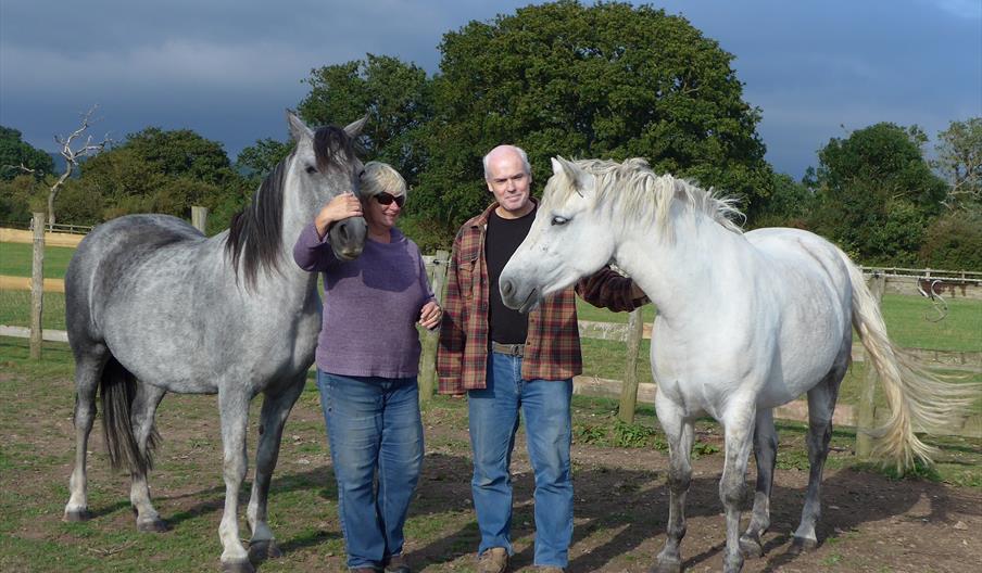 Pam and Paul with 2 of their Connemaras