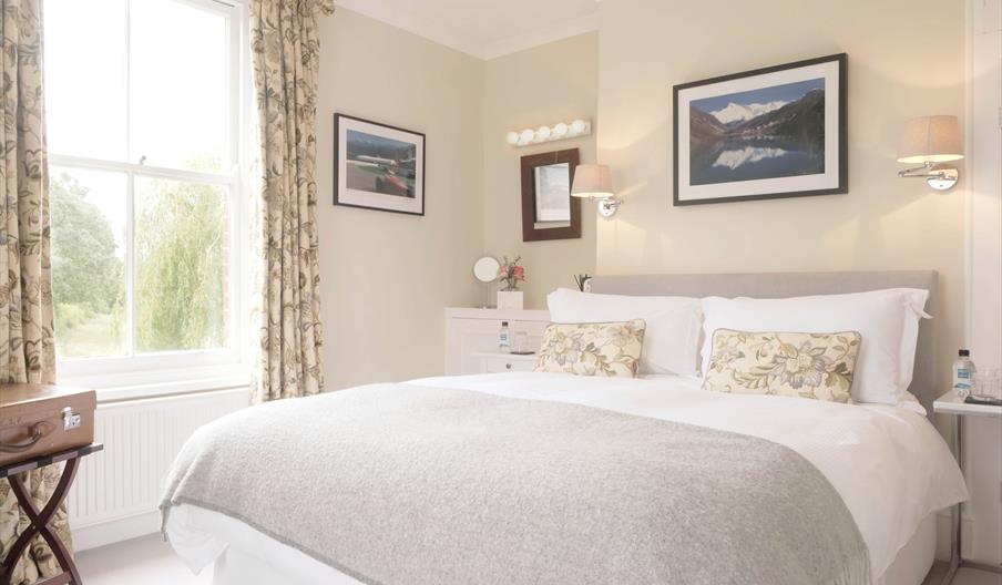 bedroom with double bed and large window