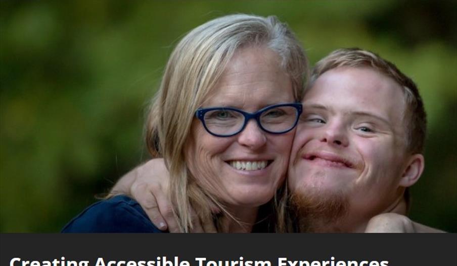 two smiling people looking at the camera