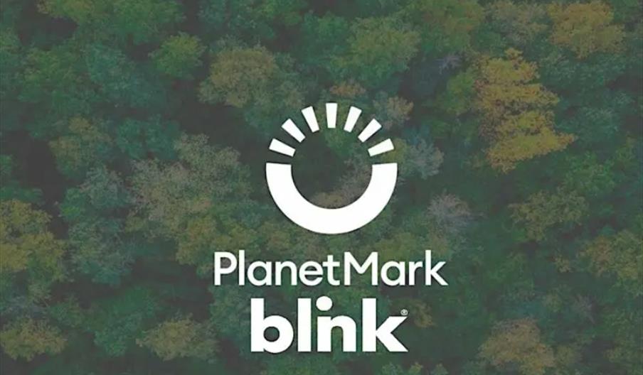 arial view of the forest canopy with the words PlanetMark Blink