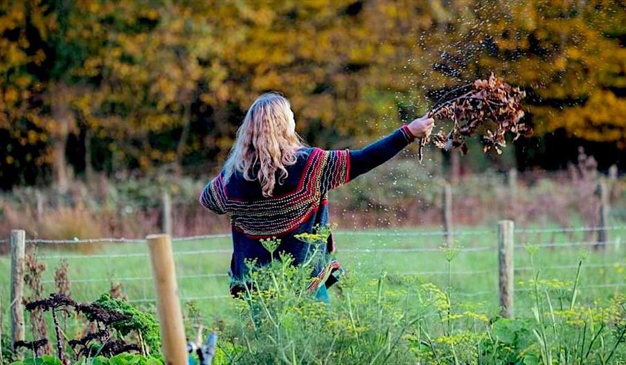 a woman in standing in a field