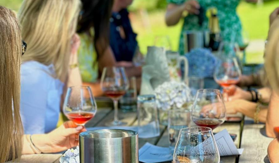 wine tasting in the sunshine at charles palmer vineyard
