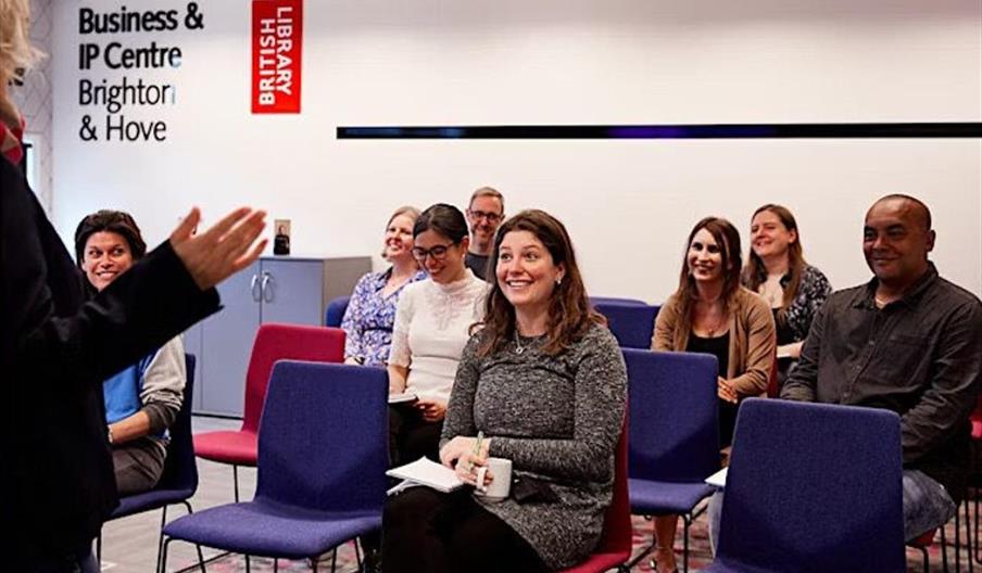 people listening to a workshops presentation