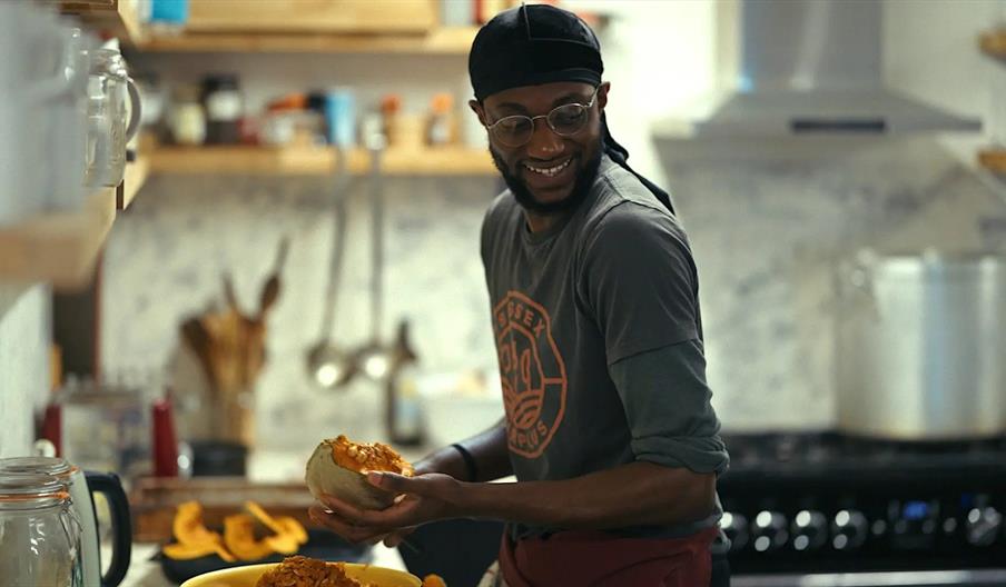 a chef preparing food in a kitchen