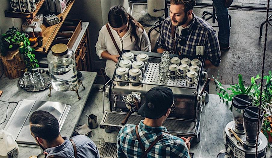 a view from above of a cafe with people working