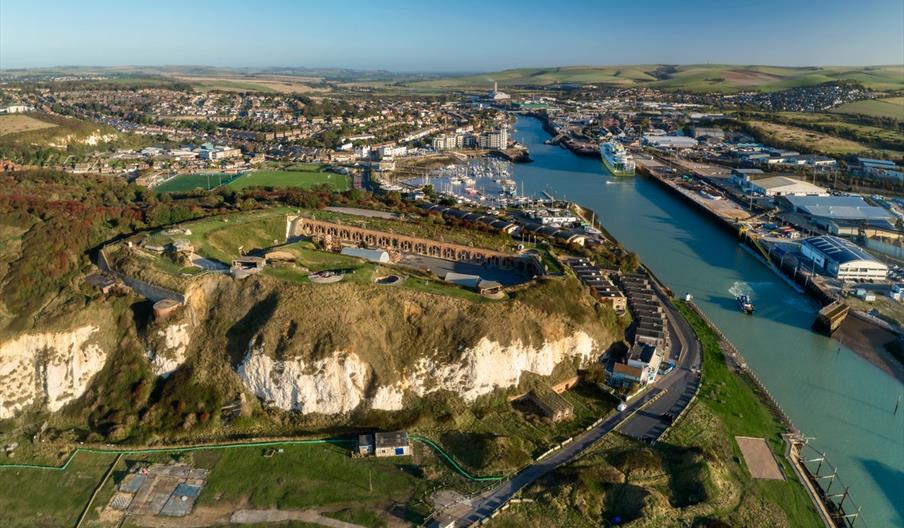 aerial shot of newhaven fort in the foreground from above with the river and town in the distance
