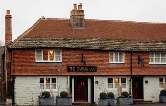 Swan Inn, fittleworth pub building with red tile roof and chimney