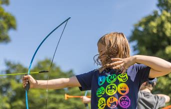 A child does archery.