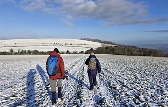 walkers on the south downs way on an frosty morning
