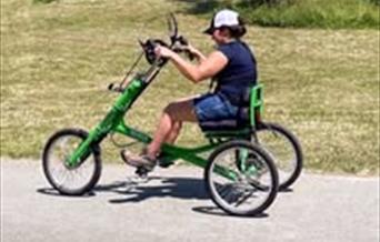 A person using a hand propelled bike