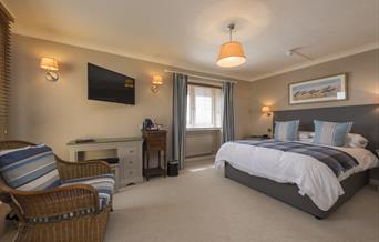 A guest bedroom at The Beachcroft Hotel