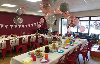 Cjs Cafe with tables set up for a birthday party