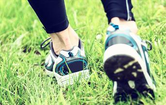 White, black and blue running shoes