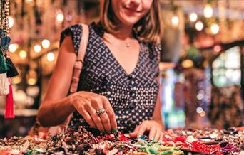 Woman browsing handmade crafts